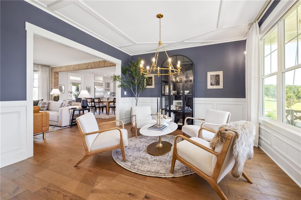 815 North Hampton Way Monroe, GA 30656 - Photo 10 of 89 a living room with fireplace furniture and a chandelier