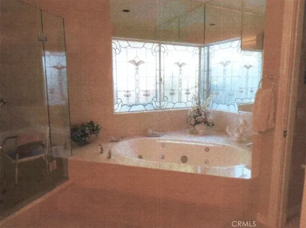a bath tub sitting next to a window