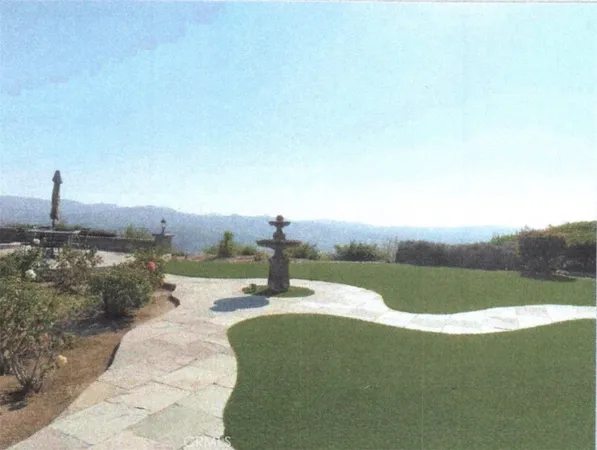 a view of a lake with a yard