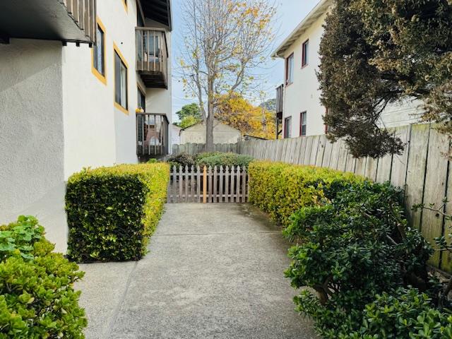 1172 First Street Monterey, CA 93940 - Photo 12 of 31 a view of a porch with plants and wooden fence