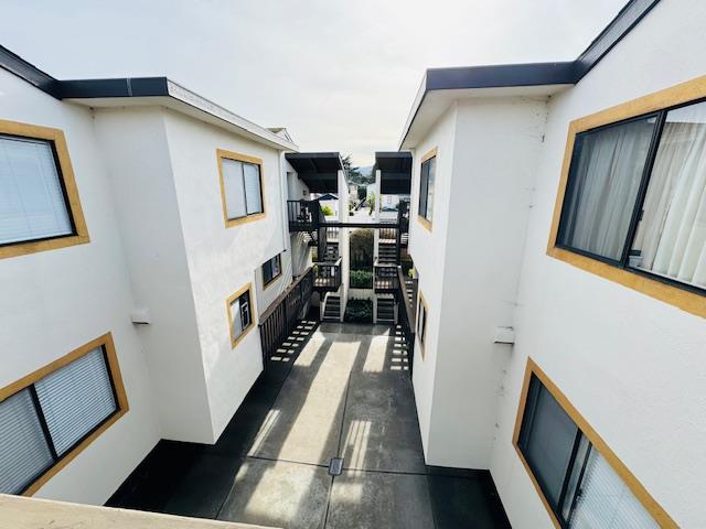 1172 First Street Monterey, CA 93940 - Photo 16 of 31 a view of a hallway with wooden floor and staircase