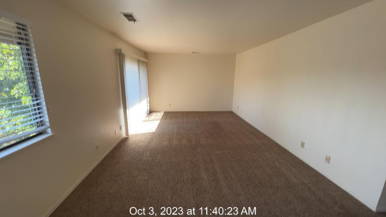 1172 First Street Monterey, CA 93940 - Photo 20 of 31 an empty room with wooden floor and windows
