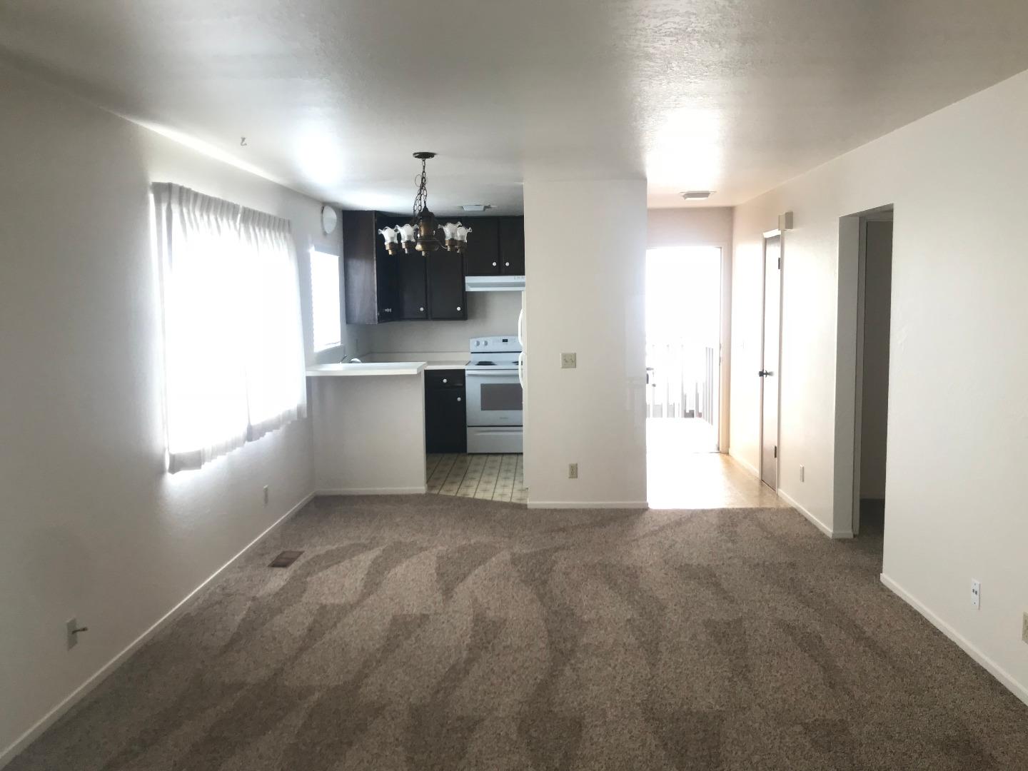 1172 First Street Monterey, CA 93940 - Photo 31 of 31 a view of a kitchen with a stove cabinets and a window