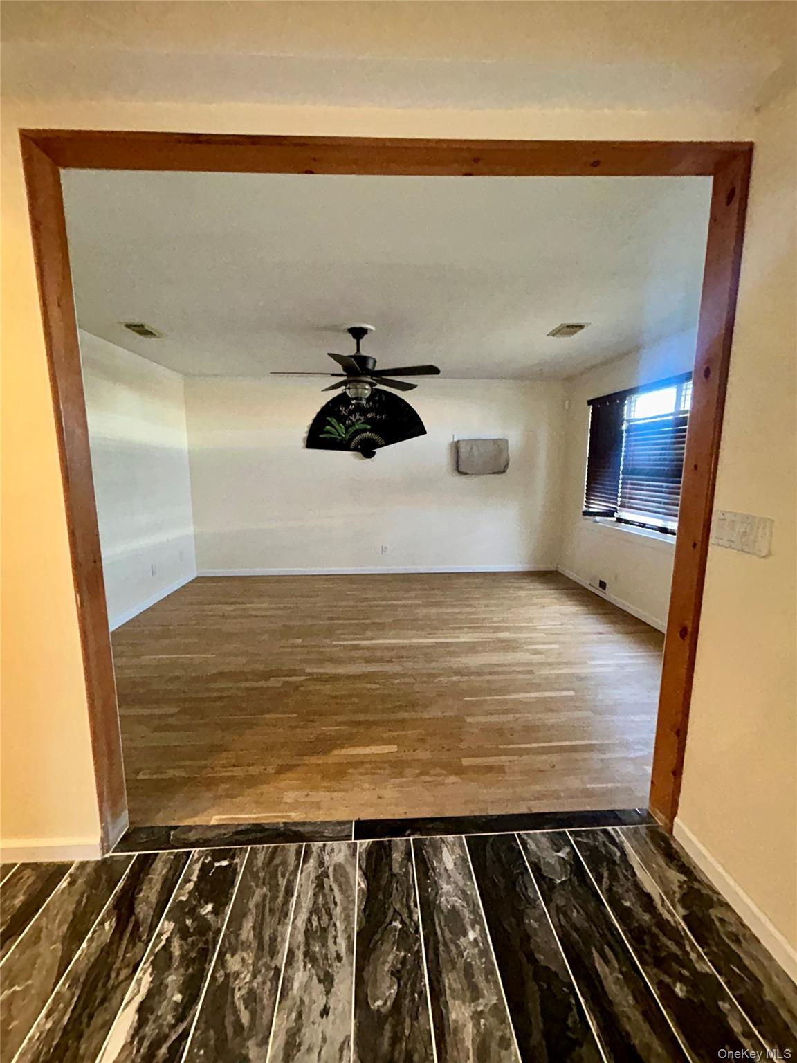 1255 Udall Road Bay Shore, NY 11706 - Photo 3 of 8 Corridor featuring dark wood-style floors and baseboards