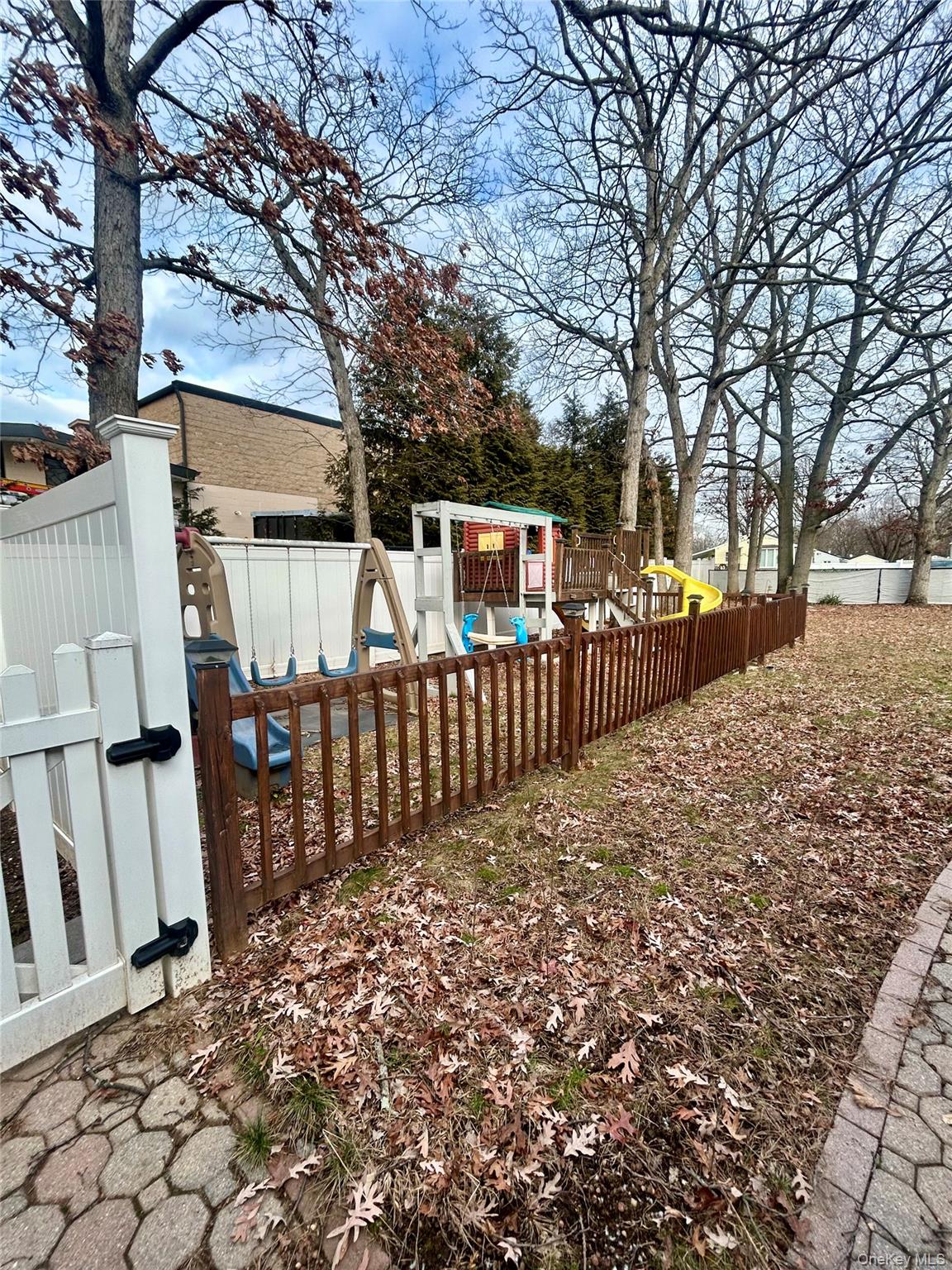1255 Udall Road Bay Shore, NY 11706 - Photo 6 of 8 View of yard featuring a playground