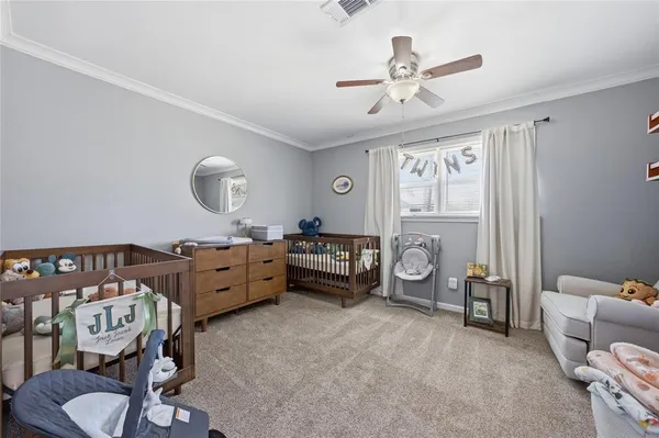 a bedroom with furniture and a window