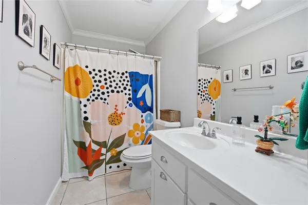 a bathroom with a sink and mirror with toilet