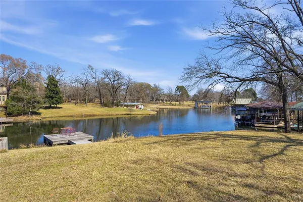 a swimming pool with outdoor seating and yard