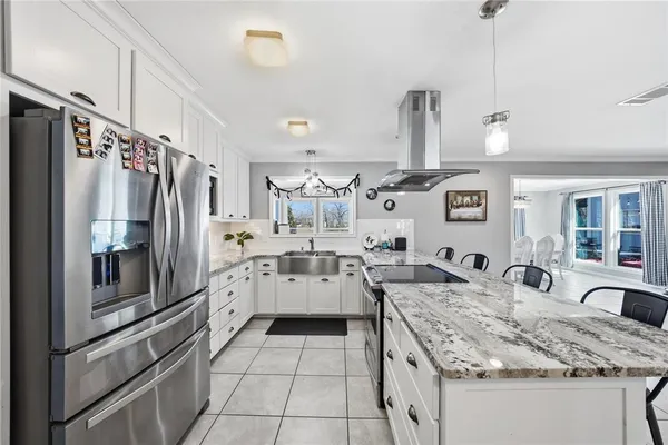 a kitchen with a sink stove and refrigerator