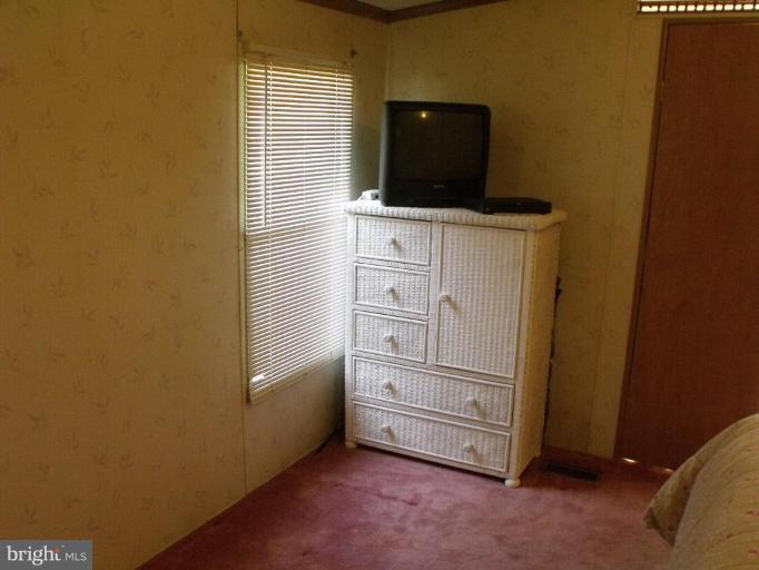 10505 Cedarville Road, Unit 1015 Brandywine, MD 20613 - Photo 13 of 26 a view of an empty room and cabinet