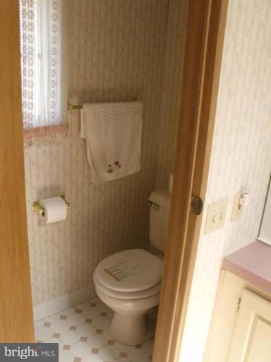 10505 Cedarville Road, Unit 1015 Brandywine, MD 20613 - Photo 16 of 26 a bathroom with a toilet and a shower
