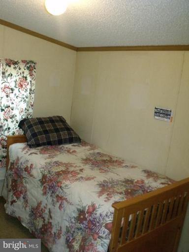 10505 Cedarville Road, Unit 1015 Brandywine, MD 20613 - Photo 17 of 26 a bedroom with a bed and a window