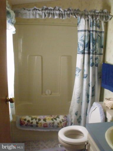 10505 Cedarville Road, Unit 1015 Brandywine, MD 20613 - Photo 19 of 26 a bathroom with a toilet and a shower