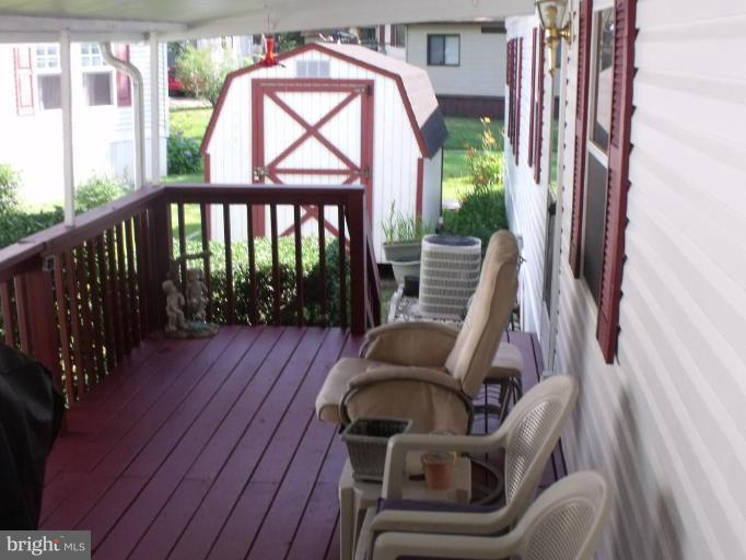 10505 Cedarville Road, Unit 1015 Brandywine, MD 20613 - Photo 3 of 26 a view of balcony with furniture and garden view