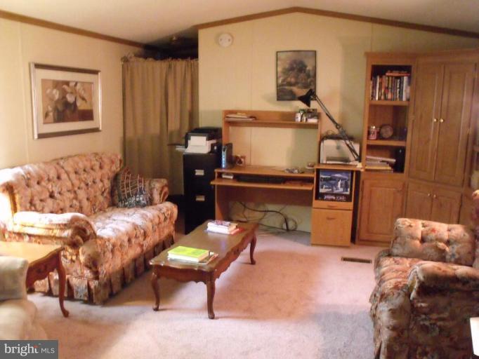 10505 Cedarville Road, Unit 1015 Brandywine, MD 20613 - Photo 25 of 26 a living room with furniture and a couch