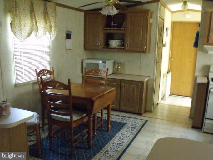 10505 Cedarville Road, Unit 1015 Brandywine, MD 20613 - Photo 9 of 26 a view of a dining room with furniture