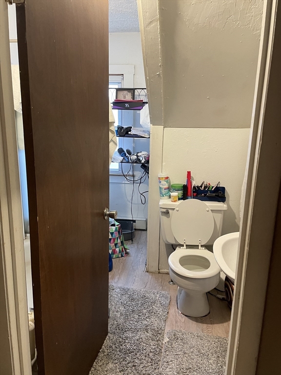 61-63 Pomona Street Springfield, MA 01108 - Photo 9 of 10 a bathroom with a sink and a toilet