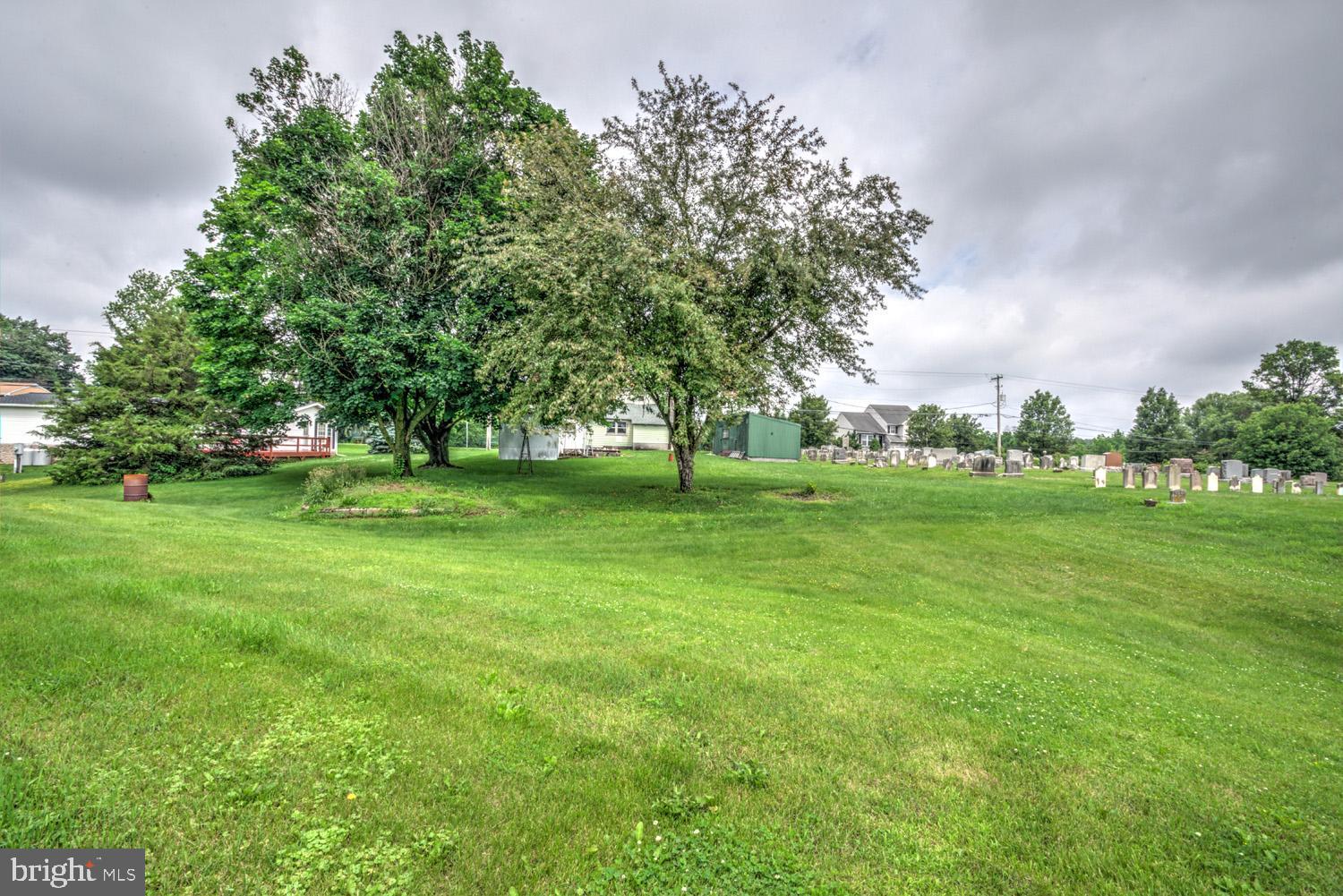 1011 Mount Joy Road Manheim, PA 17545 - Photo 10 of 33 a view of grassy field with benches and trees all around