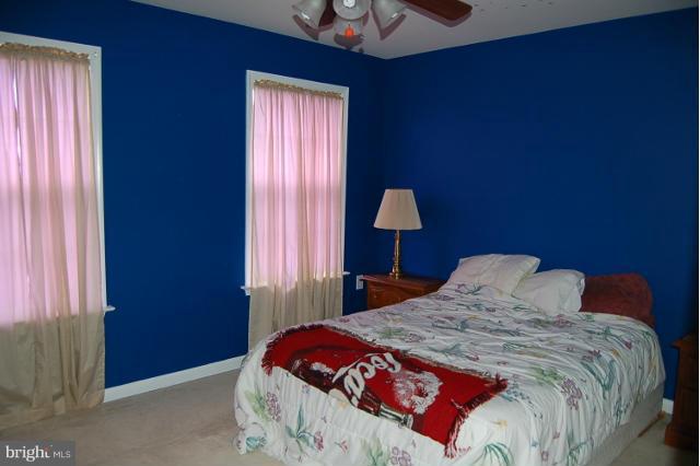 264 Rudder Road Shepherdstown, WV 25443 - Photo 14 of 30 a bedroom with a bed and a window