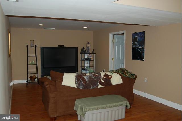 264 Rudder Road Shepherdstown, WV 25443 - Photo 21 of 30 a living room with furniture and a flat screen tv