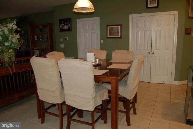 264 Rudder Road Shepherdstown, WV 25443 - Photo 4 of 30 a view of a dining room with furniture and wooden floor