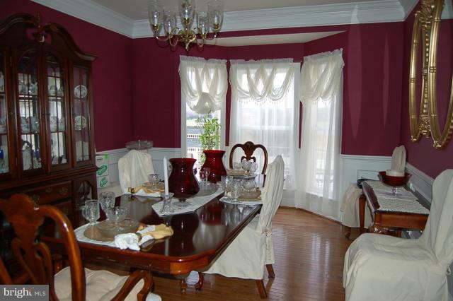 264 Rudder Road Shepherdstown, WV 25443 - Photo 6 of 30 a living room with furniture and a chandelier