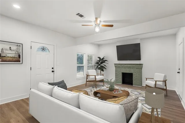 a living room with furniture and a fireplace