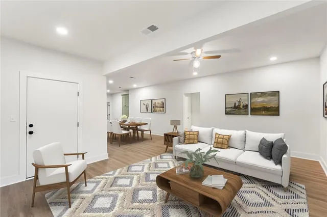 a living room with furniture and a lamp
