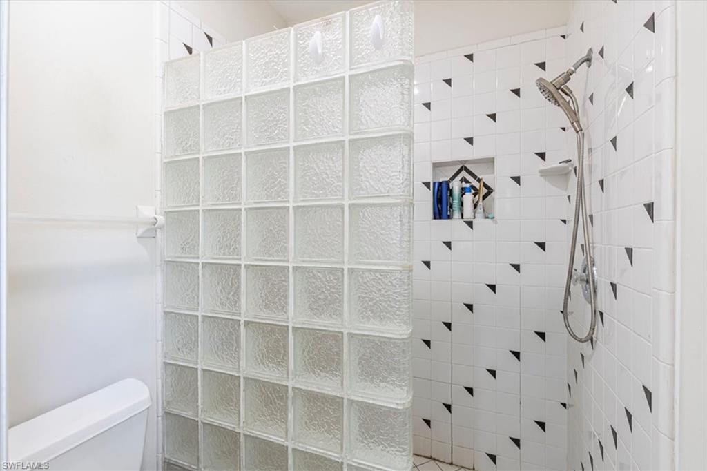 3618 Cottage Club Lane Naples, FL 34105 - Photo 15 of 26 a view of a livingroom with cabinet