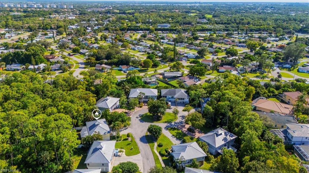 3618 Cottage Club Lane Naples, FL 34105 - Photo 25 of 26 an aerial view of residential houses with outdoor space and trees