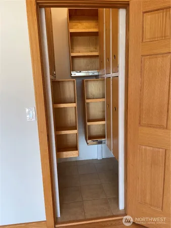 a room with a refrigerator and a stove