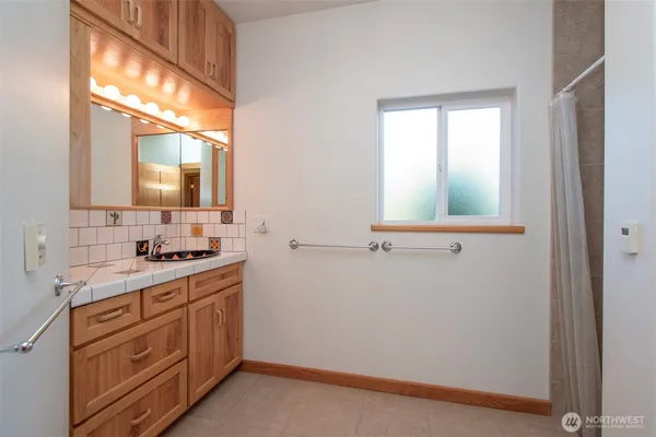 a bathroom with a sink and a mirror