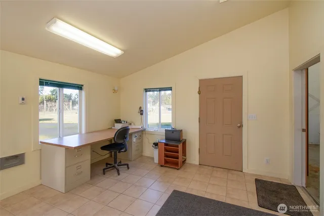 a view of a big yard next to a house with a yard