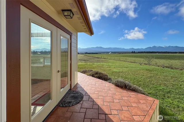 a view of a swimming pool with mountains in the background