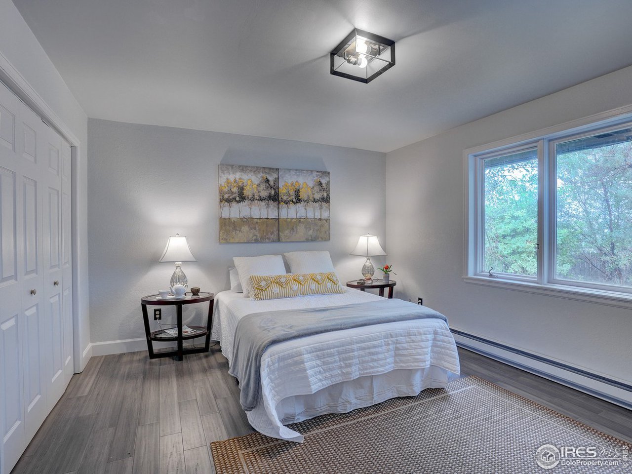 7823 Hygiene Road Longmont, CO 80503 - Photo 12 of 21 a bedroom with a bed and a table in it