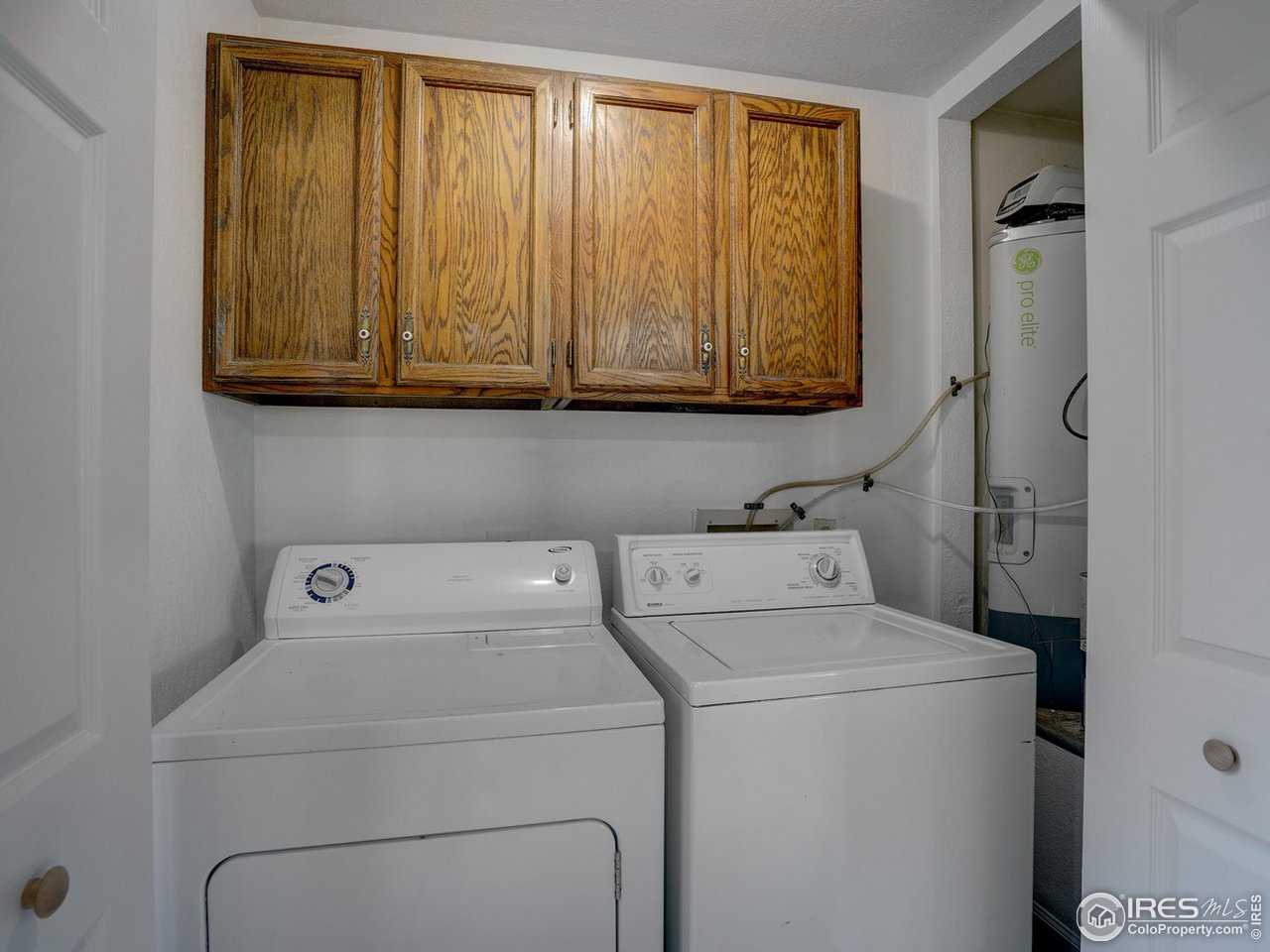 7823 Hygiene Road Longmont, CO 80503 - Photo 17 of 21 a utility room with dryer and washer