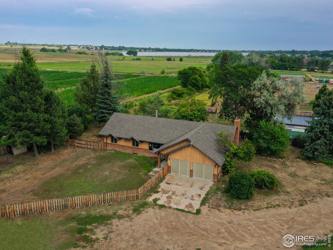 7823 Hygiene Road Longmont, CO 80503 - Photo 19 of 21 an aerial view of a house with a yard and lake view