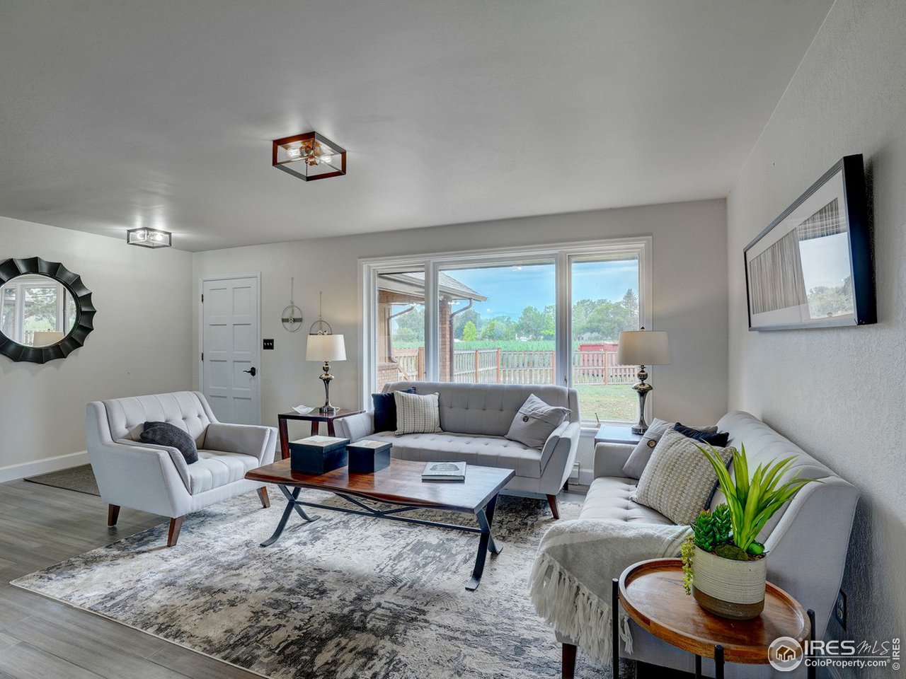 7823 Hygiene Road Longmont, CO 80503 - Photo 4 of 21 a living room with furniture and a large window