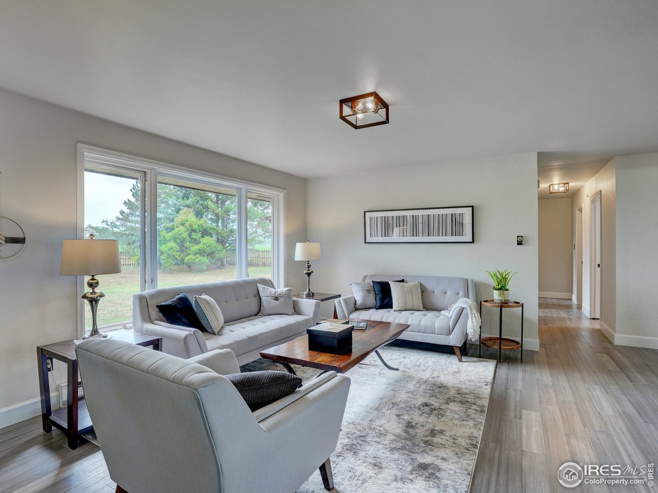 7823 Hygiene Road Longmont, CO 80503 - Photo 5 of 21 a living room with furniture and a large window