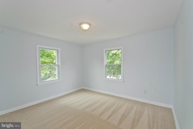 6600 Riggs Road Hyattsville, MD 20783 - Photo 2 of 24 an empty room with windows