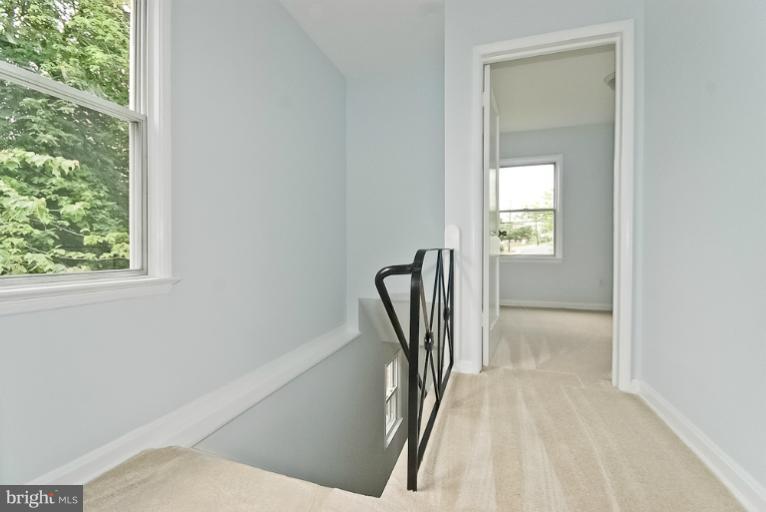 6600 Riggs Road Hyattsville, MD 20783 - Photo 12 of 24 a view of a livingroom with a fireplace