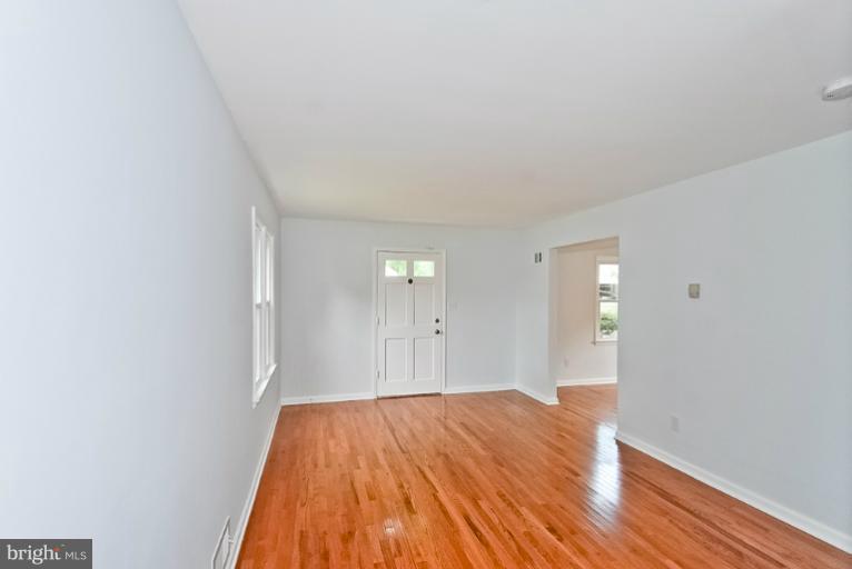 6600 Riggs Road Hyattsville, MD 20783 - Photo 14 of 24 a view of a room that has wooden floor and a sink