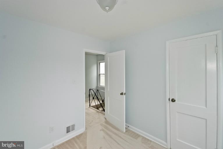 6600 Riggs Road Hyattsville, MD 20783 - Photo 15 of 24 a view of a livingroom with wooden floor