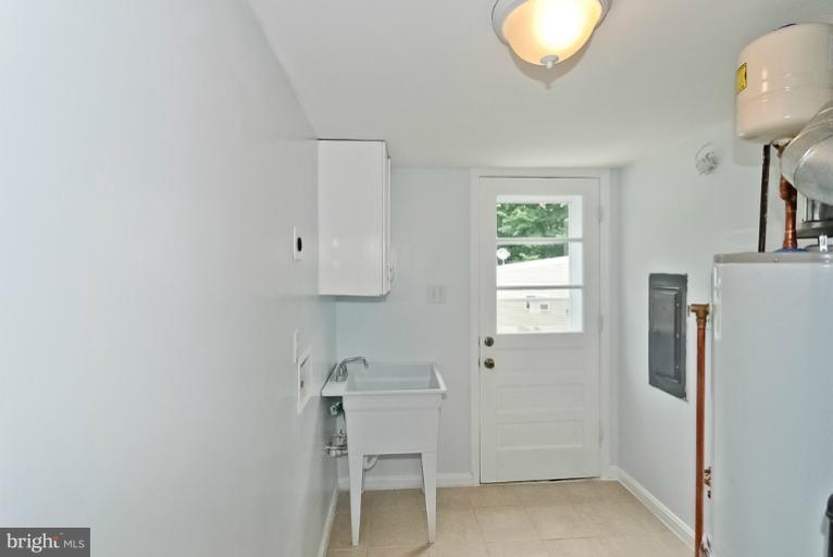 6600 Riggs Road Hyattsville, MD 20783 - Photo 18 of 24 a bathroom with a sink and a mirror