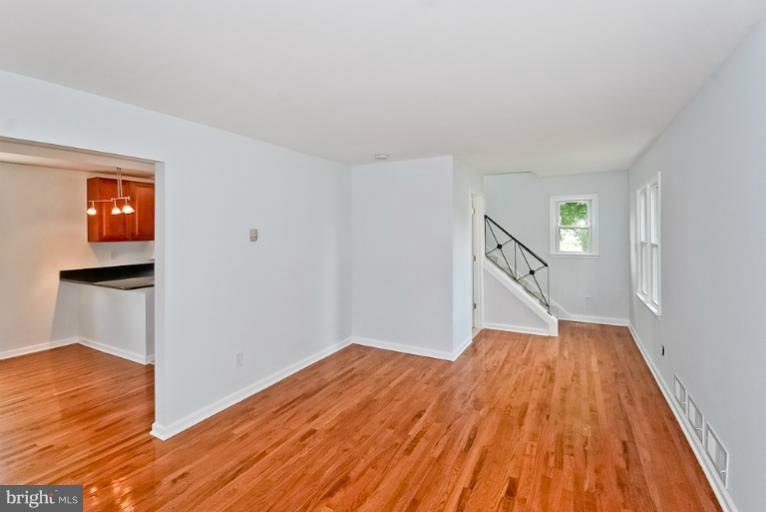 6600 Riggs Road Hyattsville, MD 20783 - Photo 20 of 24 a view of empty room with wooden floor