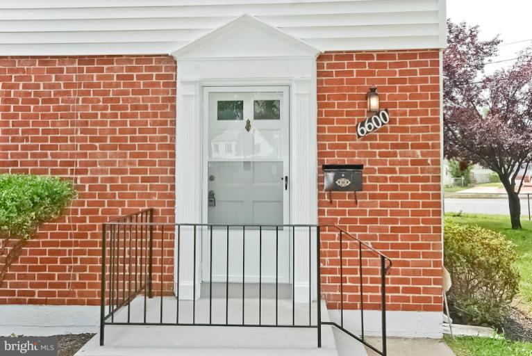 6600 Riggs Road Hyattsville, MD 20783 - Photo 3 of 24 a view of a brick building next to a yard