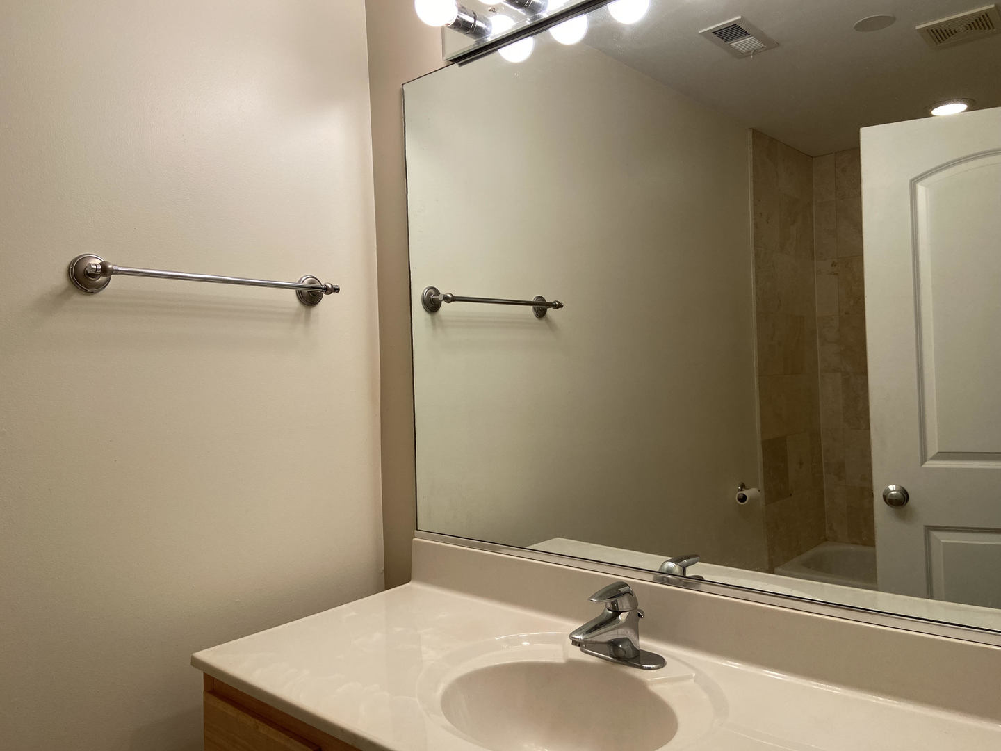 2525 West Harrison Street, Unit 2 Chicago, IL 60612 - Photo 13 of 16 a bathroom with a sink and a mirror