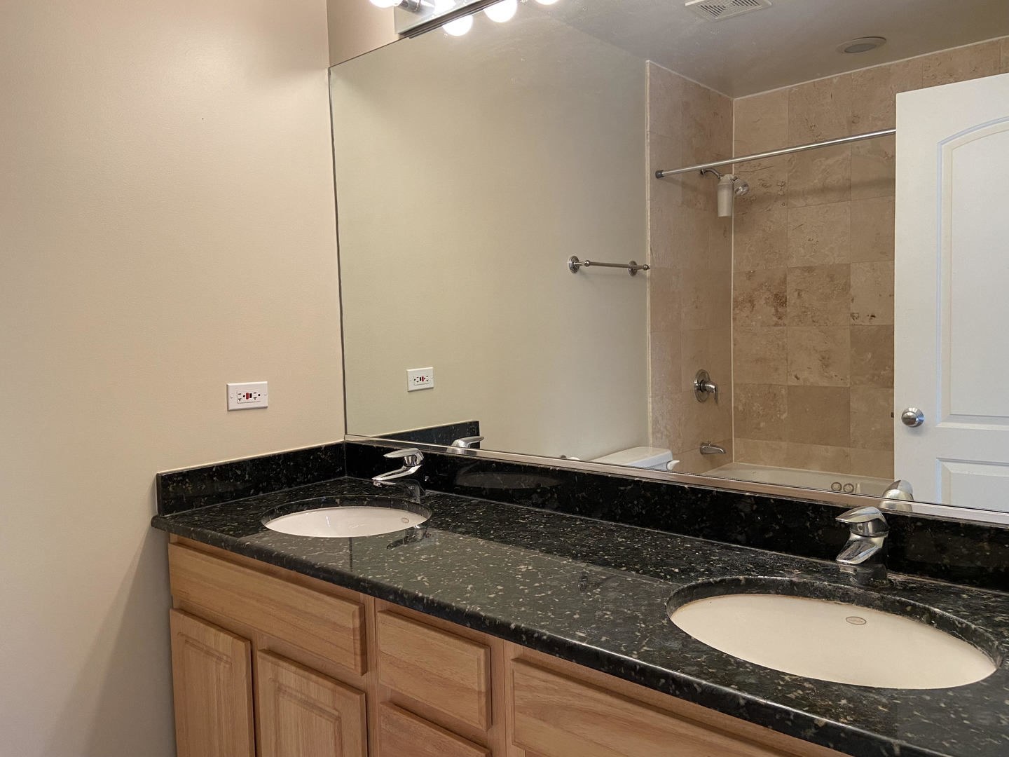2525 West Harrison Street, Unit 2 Chicago, IL 60612 - Photo 9 of 16 a bathroom with a sink double vanity and a mirror