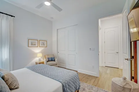 a bedroom with a bed and a couch