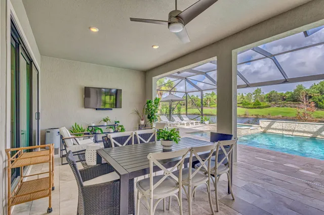 a view of a dining room with furniture window and outside view